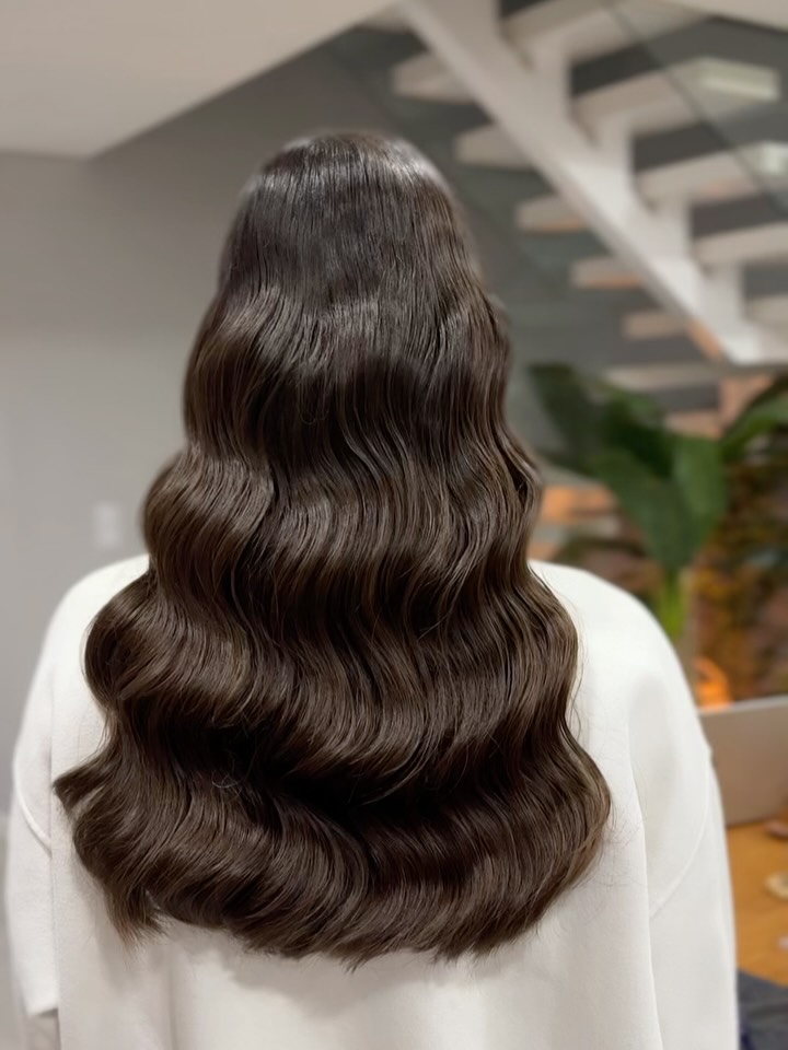 Long polished brunette waves viewed from behind